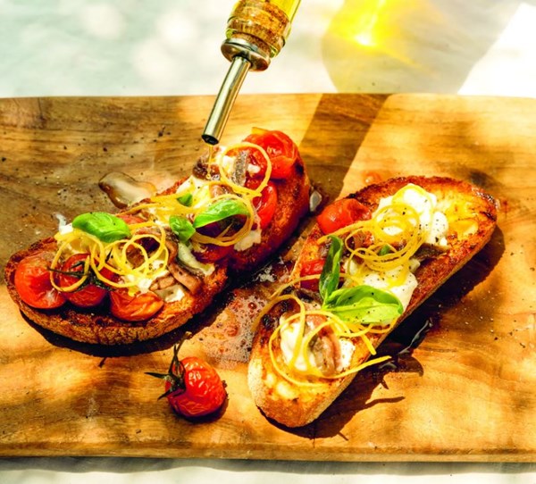 Bruschetta with stracciatella & anchovies, confit tomatoes & lemon zest