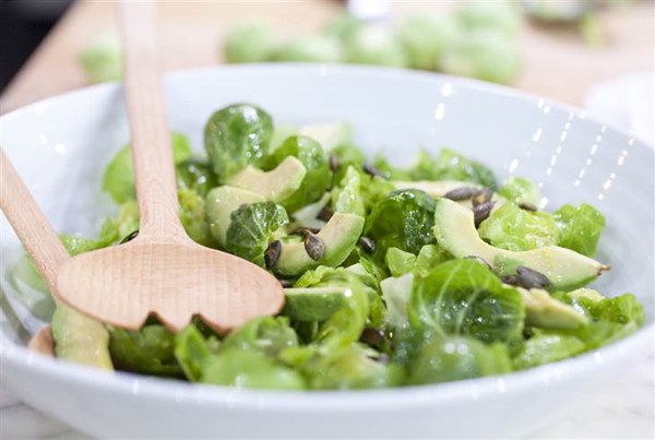 Brussels sprout salad with avocado and pumpkin seeds