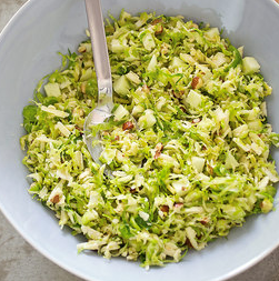 Brussels sprout salad with cheddar, hazelnuts, and apple