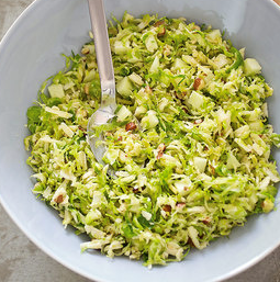 Brussels sprout salad with cheddar, hazelnuts, and apple