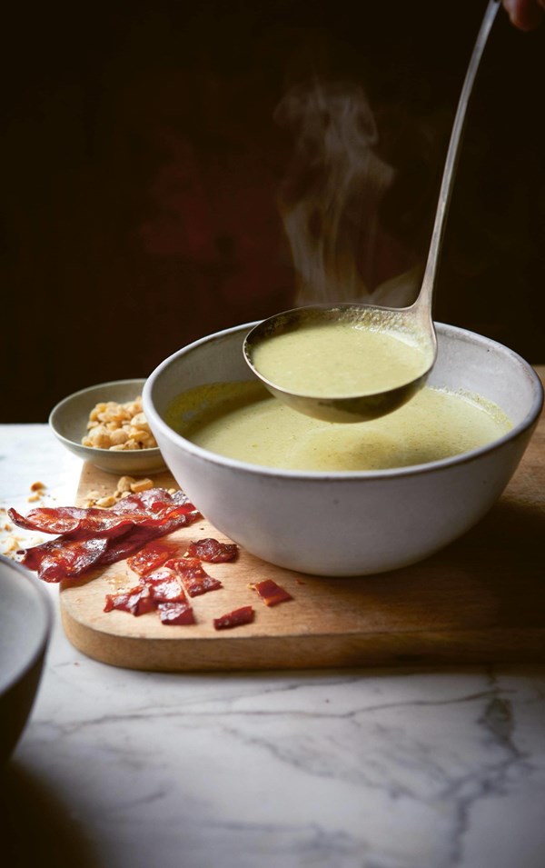 Brussels sprout soup with candied bacon and roasted hazelnuts