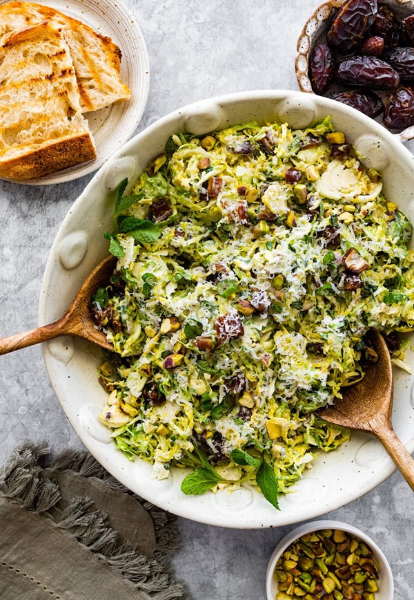 Brussels sprouts salad with dates, Parmesan cheese, pistachios & creamy lemon dressing