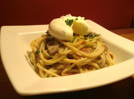 Bucatini carbonara with cremini mushrooms and a warm poached egg