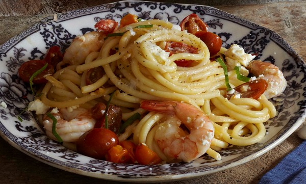 Bucatini with spicy cherry tomatoes, aged feta, and shrimp