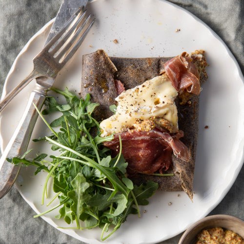 Buckwheat crepes with jambon sec de Corse, Camembert, arugula, and grain mustard