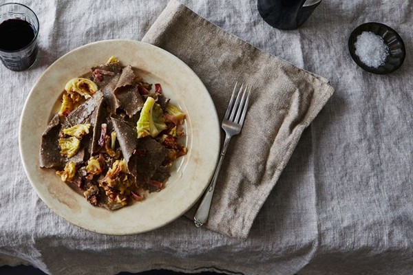 Buckwheat pasta with charred cabbage, speck, and provolone