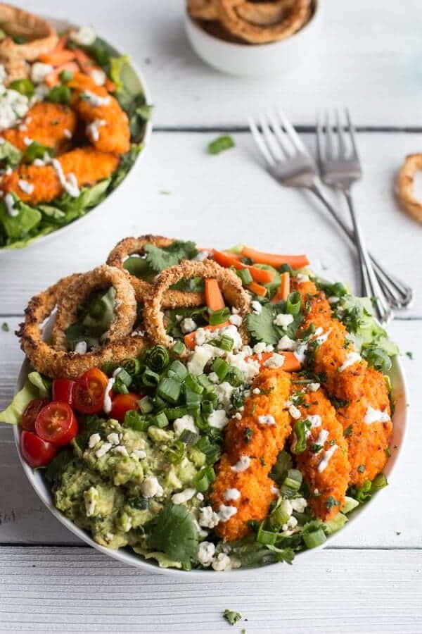Buffalo chicken and crunchy baked onion ring salad with blue cheese