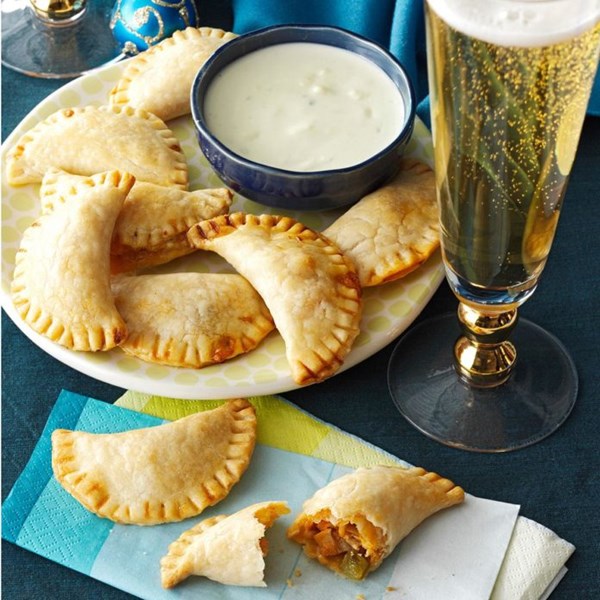 Buffalo chicken empanadas with blue cheese sauce