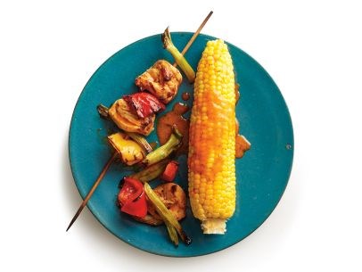 Buffalo chicken kebabs with corn on the cob