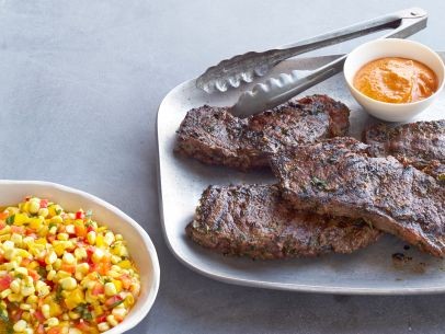 Buffalo steaks with pickled corn salad and hottish sauce