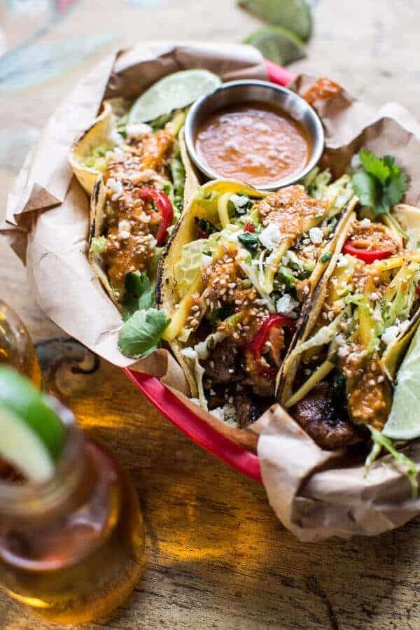 Bulgogi BBQ pork tacos with charred tomatillo sesame sauce + spring onion slaw