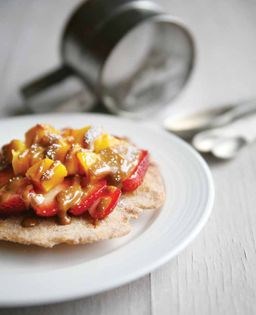Buñuelos topped with strawberries, mangos, and caramel (Buñuelos con fresas, mangos y cajeta)