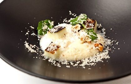Burnt apples with goat's curd, cobnut and watercress