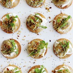 Burnt eggplant and goat's curd toasts with orange and sesame powder