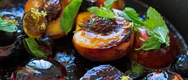 Burnt peaches and figs with Amaretto, lemon zest, and mint