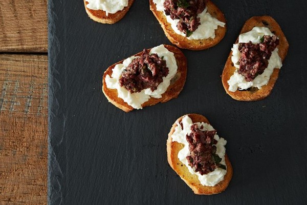 Burrata and olive tapenade crostinis