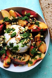 Burrata Caprese with tomatoes, peaches, and basil vinaigrette