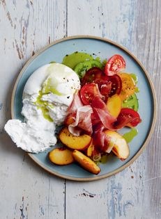 Burrata, peaches and prosciutto with basil oil
