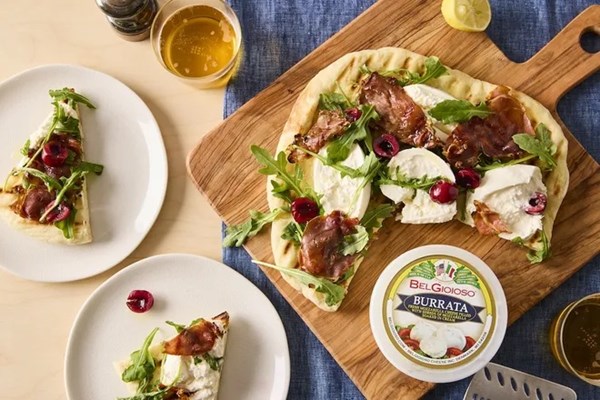 Burrata pizza with prosciutto, cherries & arugula