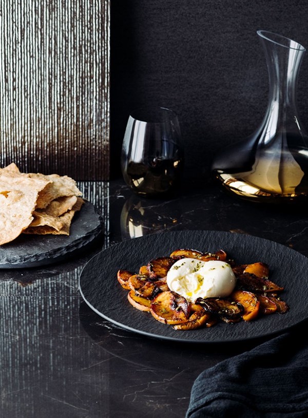 Burrata with charred peaches, toasted fennel oil and lavosh