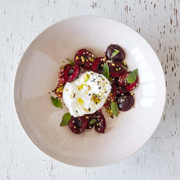 Burrata with pistachio dukkah and cherries