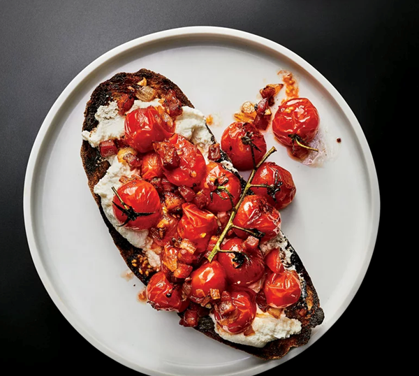 Burst cherry tomatoes and pancetta