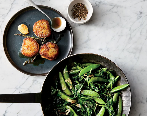 Butter-basted scallops with spring greens and snap peas