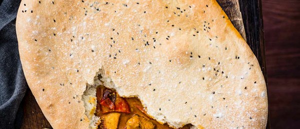 Butter chicken pie with naan crust