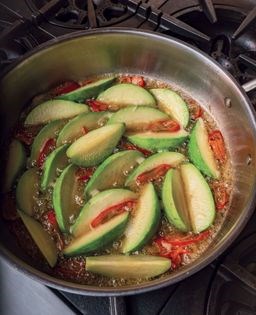Butter-glazed avocado squash with chiles, caciocavallo, crunchies & garlic chives