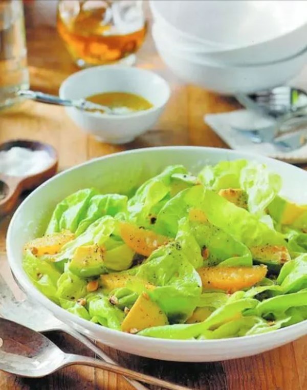 Butter lettuce salad with orange, hazelnuts, avocado, and shallot-hazelnut vinaigrette