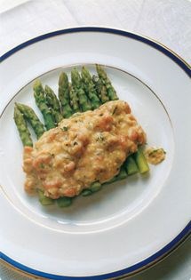 Buttered eggs with brown shrimps & dill on asparagus