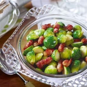 Buttered sprouts with crispy bacon rolls