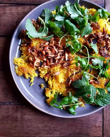 Buttered turmeric rice w/ crushed almonds & herbs