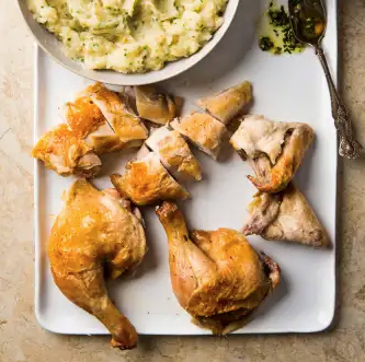 Butterflied chicken with garlic smashed potatoes