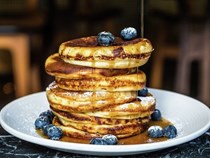 Buttermilk pancakes with blueberries and maple syrup