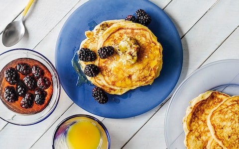 Buttermilk pancakes with maple-ginger butter and blackberries in bourbon syrup