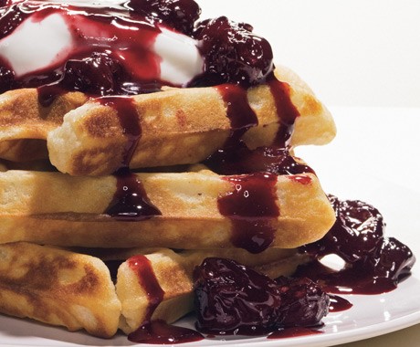 Buttermilk waffles with cherry-almond sauce