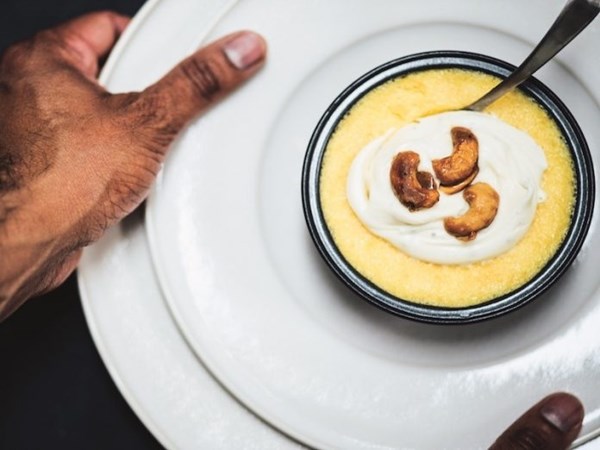 Butternut squash pudding with cardamom crème fraîche and caramelized cashews