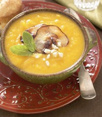 Butternut squash soup with curried pecans, apple, and goat cheese