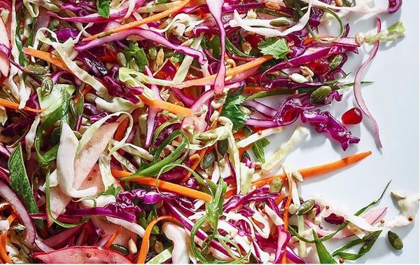 Cabbage, apple, and pomegranate slaw with cumin dressing
