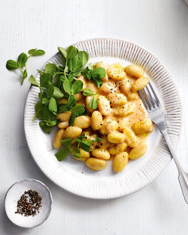 Cacio e pepe gnocchi with mint & pea shoots