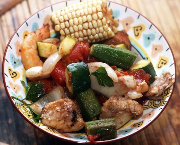 Cajun inspired grill with summer vegetables, shrimp, sausage and catfish