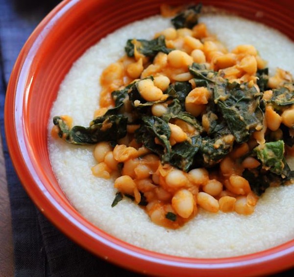 Cajun white beans and kale over creamy grits