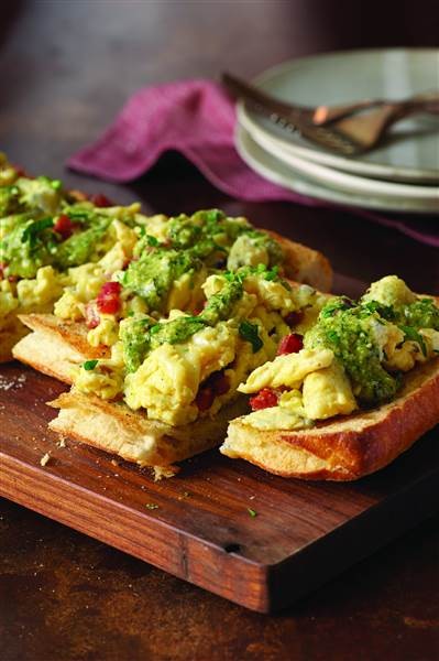 Calabrian scrambled eggs with jalapeño pesto bruschetta