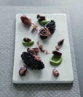 Calamari with squid ink rice and green chilli salsa