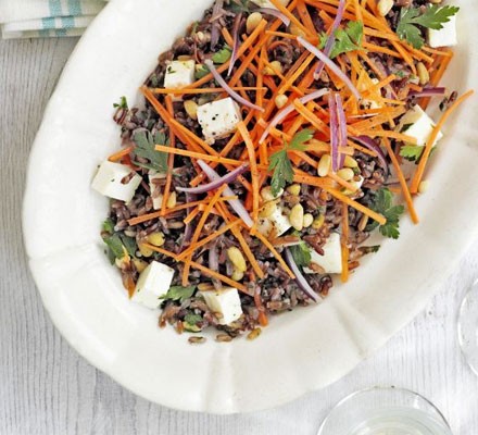 Camargue red rice salad with feta and pine nuts