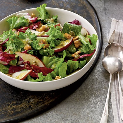 Candied walnut, pear, and leafy green salad