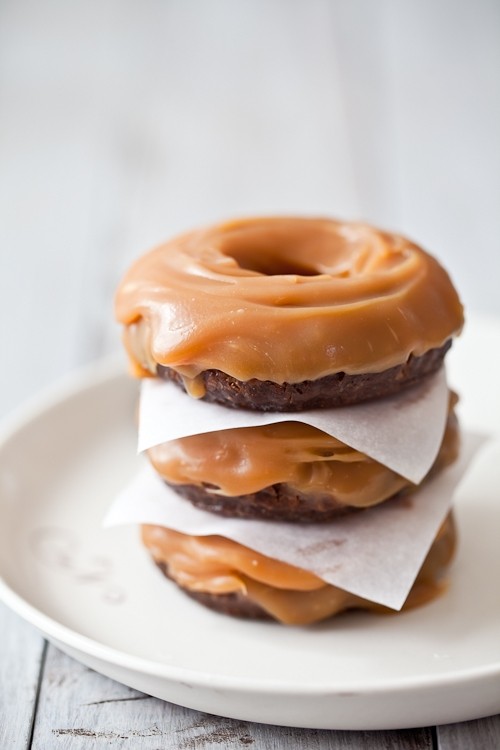 Candy filled chocolate cake doughnuts with salted butter caramel sauce