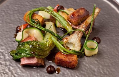 Cannon of Welsh lamb with black olive, tomato and courgette