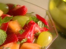 Cantaloupe, strawberries, and grapes with white wine and mint